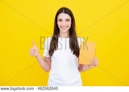 Portrait Of Student Woman. College Or High School Ducation. Young Woman With Notebooks Smiling At Ca