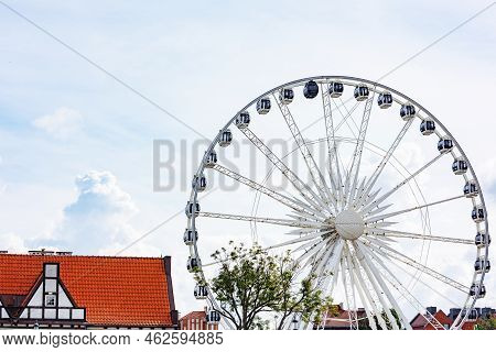 Beautiful Architecture Of The Old City. Gdansk, Poland. European Architecture. Ferris Wheel.