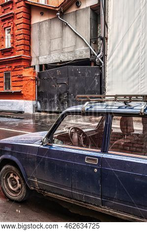 Moscow, Russia - September 12 2010: A Vintage Soviet Lada Car Is Parked In An Alley Next To An Aband