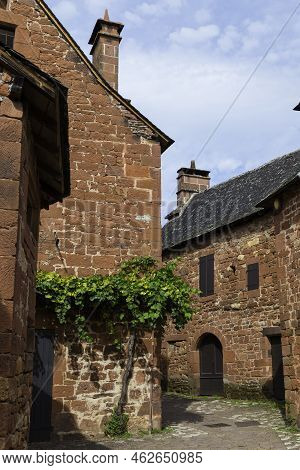 Collonges La Rouge, Distinctive Red Brick Houses And Towers Of The Medieval Old Town, France. It Is 