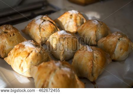 Making Apples Baked In Dough. Yummy Hot Pastry Items With White Sugar On Top On Baking Sheet