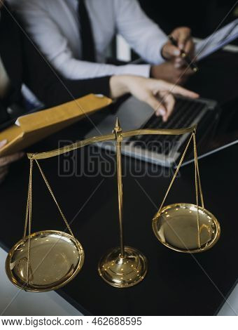 Male Lawyer Working With Contract Papers And Wooden Gavel On Tabel In Courtroom. Justice And Law ,at