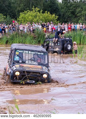Russia - August 12, 2023, Tver. The Car Overcomes Difficult Obstacles. Large-scale Sports Competitio