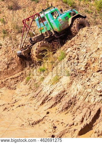 Russia - August 12, 2023, Tver. The Car Overcomes Difficult Obstacles. Large-scale Sports Competitio