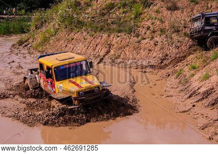 Russia - August 12, 2023, Tver. The Car Overcomes Difficult Obstacles. Large-scale Sports Competitio