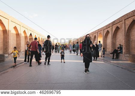 Isfahan, Iran - May 31, 2022: Woman Stand On Famous Isfahan Bridge With Traditional Iranian Clothing
