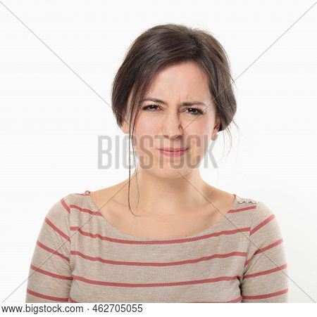 Young Brunette Woman Grimacing Like Doesn't Want To Do  Something