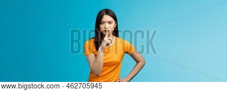 Hush Keep Quiet, Behave Well. Serious-looking Strict Asian Elder Sister Shushing Bending Towards Cam