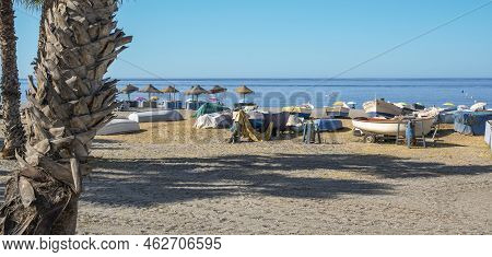 Small Fishing Boats Stranded On The Beach Of The Village Of Almuñecar In Southern Spain