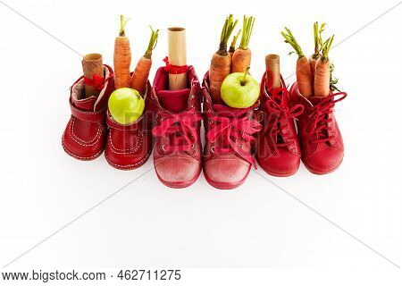 Saint Nicholas - Sinterklaas Day With Shoe, Carrot And Apples On White Background