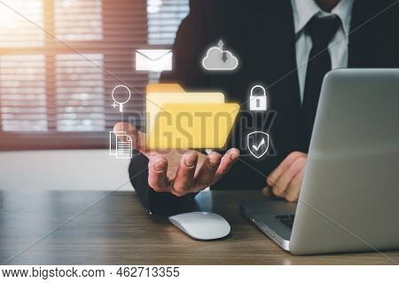 Document Management System Dms .businessman Hold Folder And Document Icon On Office Desk, Virtual On