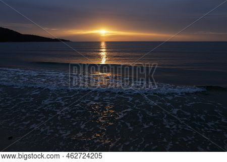 Summer Sunrise Over Golden Beach (skala Potamias) In Greece With An Overcast Sky.