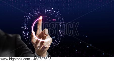 Close Up Of Businessman Hand Pointing At Abstract Glowing Max And Min Scale Hologram On Wide Dark Ba