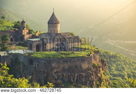 Tatev Ancient Monastery In Sunset Light. Armenia Best Famous Travel Location. Popular Tourist Destin