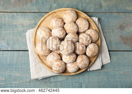 Plate With Tasty Homemade Gingerbread Cookies On Blue Wooden Table, Top View