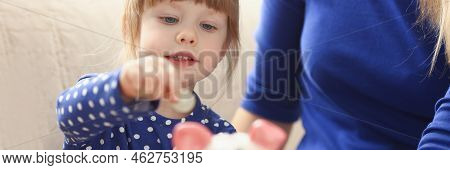 Portrait Of Child Little Girl Putting Coin Money Into Piggy Bank Container. Making Effective Future 