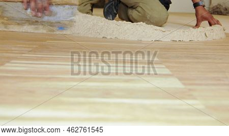 Craftsman At Parquet Floor Sealing, Varnishing The Flooring At A Building