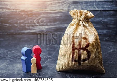 Family Figurines And Thai Baht Money Bag. Social Assistance And Support. Income Level, Budget. High 