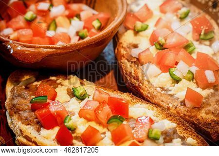 Mexican Molletes, Traditional Food With Bread, Beans, Cheese, Tomato And Chili