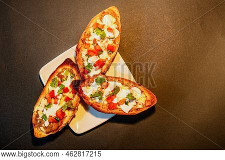 Mexican Molletes, Traditional Food With Bread, Beans, Cheese, Tomato And Chili