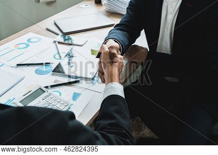 Businessman Handshake For Teamwork Of Business Merger And Acquisition, Successful Negotiate, Two Bus