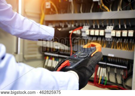 Electricity And Electrical Maintenance Service, Engineer Using Measuring Equipment Tool Checking Ele