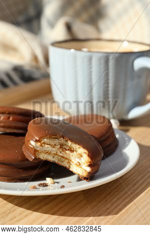 Tasty Choco Pies And Cup Of Hot Drink On Wooden Tray