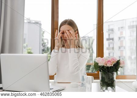 Self Face Massage On-line Course Near Laptop. Woman Doing Anti-age Massage Near Computer. Young Fema