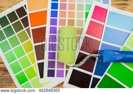Paint Roller And Color Palette Guide Close-up.color Palette, Paint Swatch Guide, Color Catalogue.