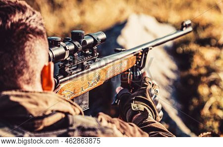 Hunter Is Aiming. Shooter Sighting In The Target. The Man Is On The Hunt. Hunt Hunting Rifle