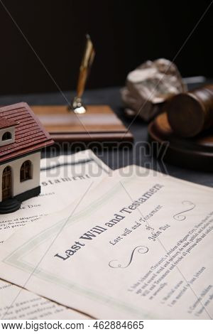 Last Will And Testament Near House Model On Grey Table, Closeup