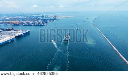 Stern Of Large Cargo Ship Import Export Container Box On The Ocean Sea On Blue Sky Back Ground Conce
