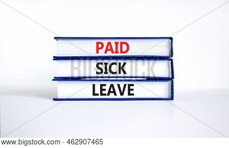 Paid Sick Leave Symbol. Concept Words Paid Sick Leave On Books. Beautiful White Table White Backgrou