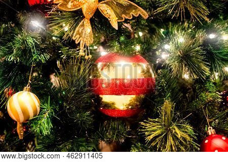 Halo Of Electtric Lights And Color Balls Decorating Artificial Christmas Tree