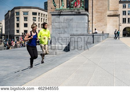 Brussels City Center, Brussels Capital Region - Belgium - 05 01 2021 Two Girls Jogging In The Park O
