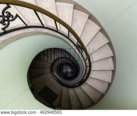 Auderghem, Brussels Capital Region - Belgium - 05 13 2021 Swirling Staircase In Pastel Colors In A P