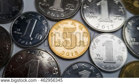 Lots Of Chinese Coins, In The Center Is A Five-jiao Coin. A 5 Jiao Coin Is Shot In Close-up. In The