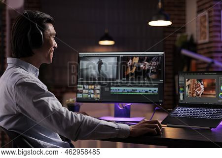 Asian Creator Editing Movie Footage With Media Software, Working On Film Montage Production. Creatin