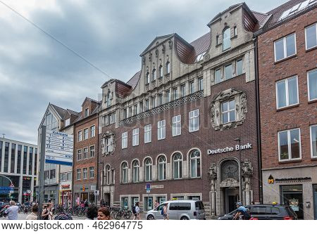 Germany, Lubeck - July 13, 2022: Tall Iconic Brown Stone Deutsche Bank Main Office Facade In Town Wi
