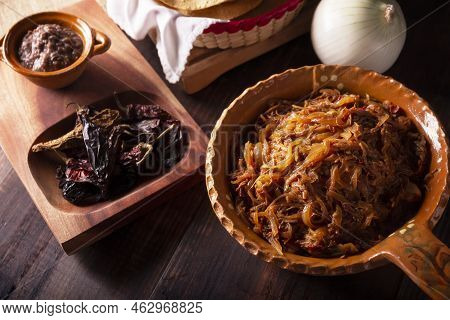 Tinga De Res. Typical Mexican Dish Prepared Mainly With Shredded Beef, Onion And Dried Chilies. It I