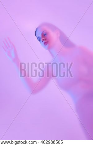 Mystical Portrait Of Young Tender Girl Immersed In Clouds Of Smoke, Fog On Pink Neon Background With