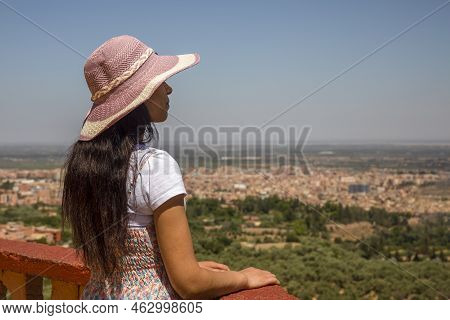 Young Woman Looking At The City Of Beni Mellal From The Middle Atlas, Which Is A City In Morocco.