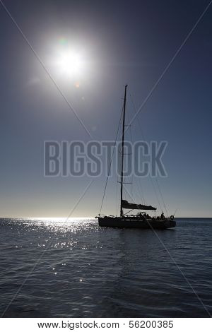 Catamaran on a sailing trip on open sea.