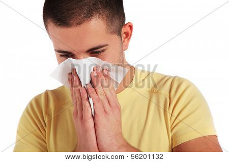 Attractive young man got a cold. All isolated on white background.