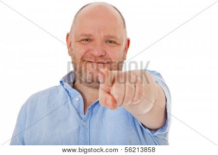 Charismatic middle aged man points with finger. All on white background.