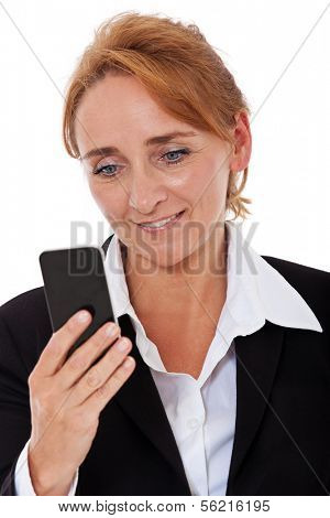 Attractive mature businesswoman looking at her smart phone. All on white background.