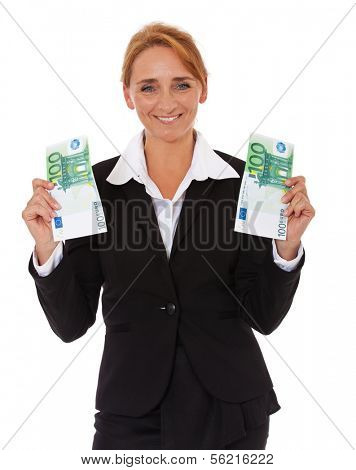 Attractive mature businesswoman holding two 100 euro notes. All on white background.