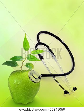 Natural medicine stethoscope and apple