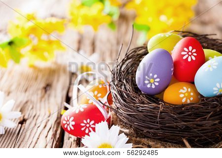 Easter still life with traditional decorative colored eggs in nest