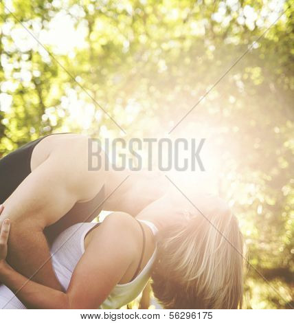 a couple kissing on a beautiful sunny day